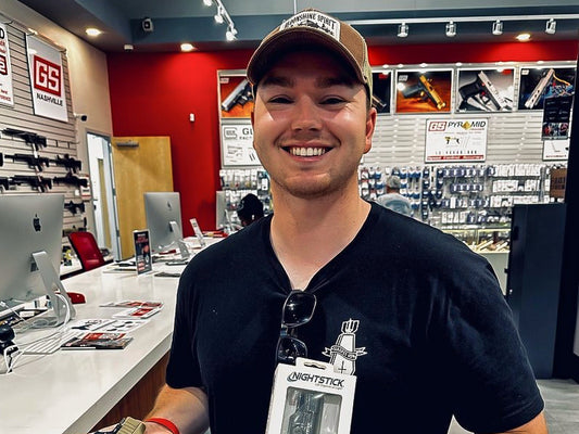 Kyle, Winner of Shoot270 Open House shooting competition, holding a custom Glock 26 and Nightstick Weapon Light. Best shooting range Nashville